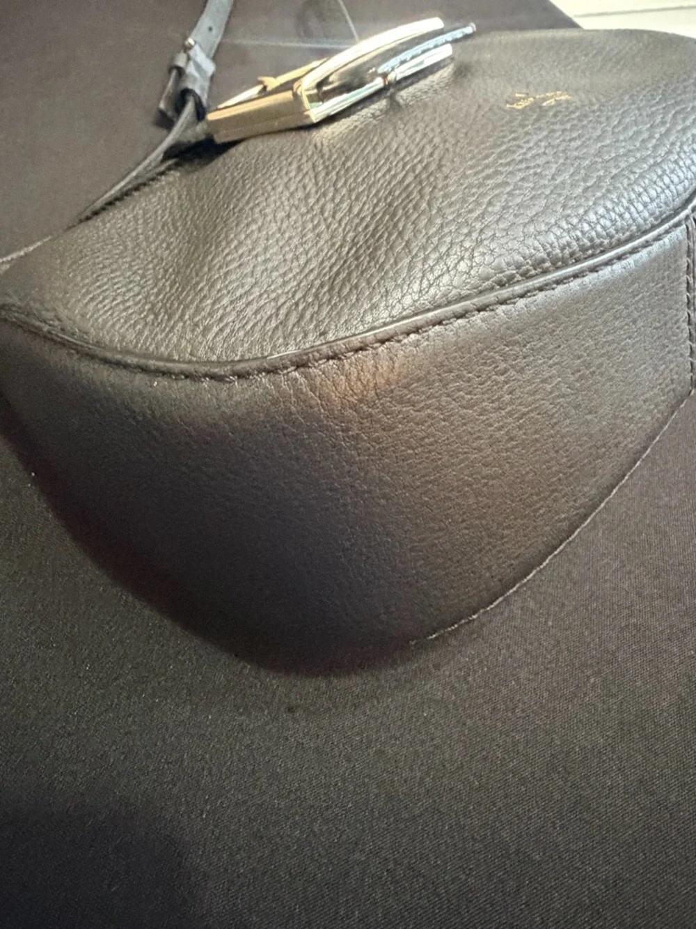 Kate Spade Black Saddle Bag Like New Condition. Very stylish and comfortable.